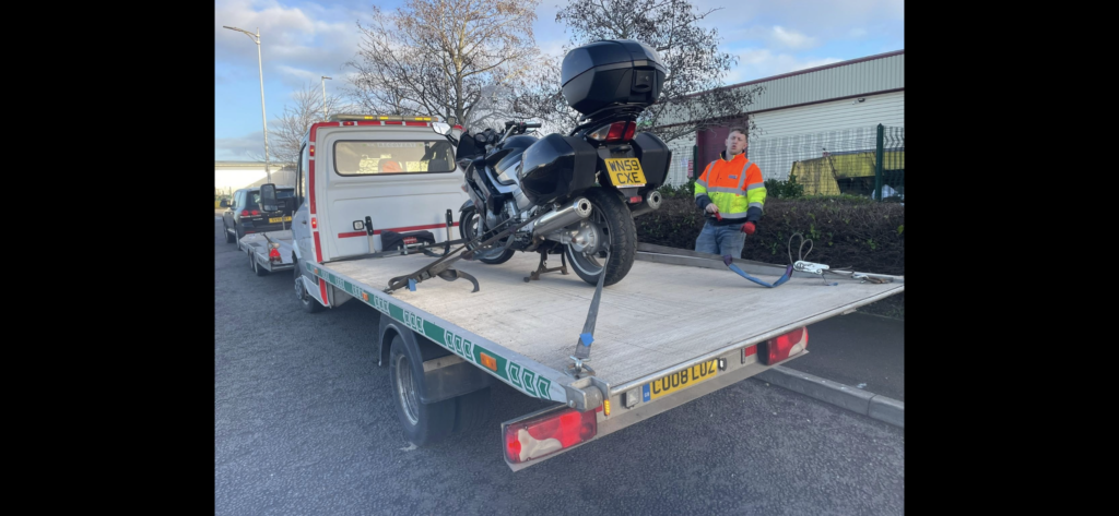 Touring motorcycle recovered on Leeds Car Recovery truck CU08 LUZ